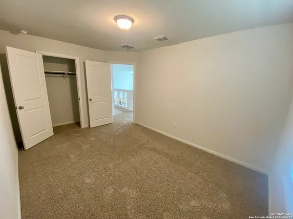 an empty room with a empty space and a window