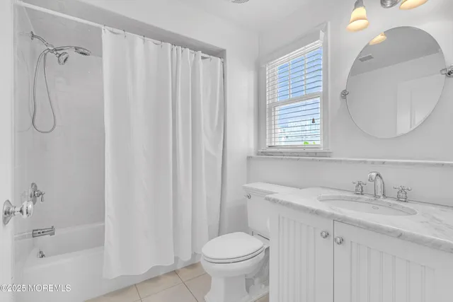 a view of house with roof deck and seating space