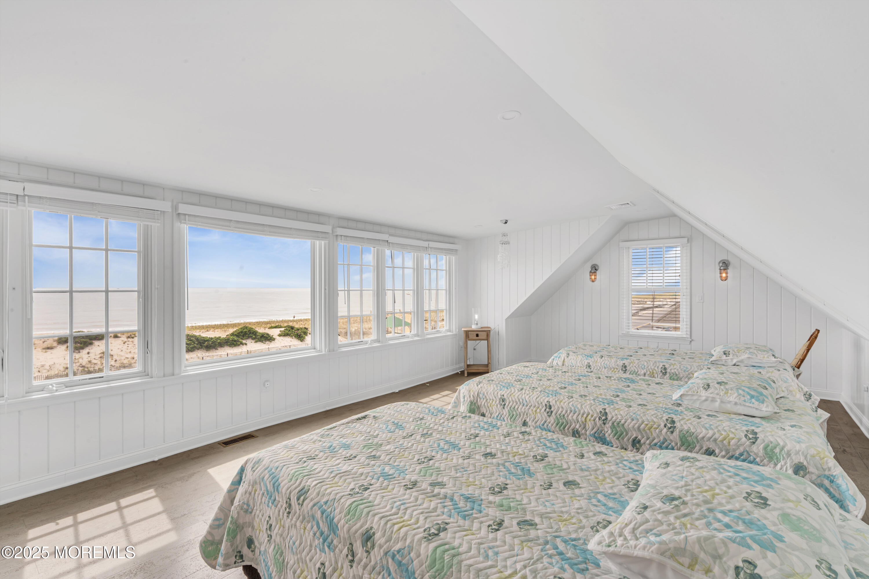 809 North Ocean Avenue Seaside Park, NJ 08752 - Photo 53 of 85 a large bed sitting in a bedroom next to a window