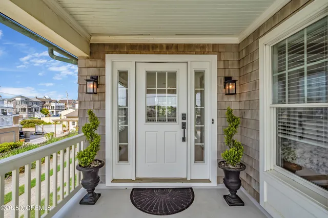 a view of entryway and hall with a dining room