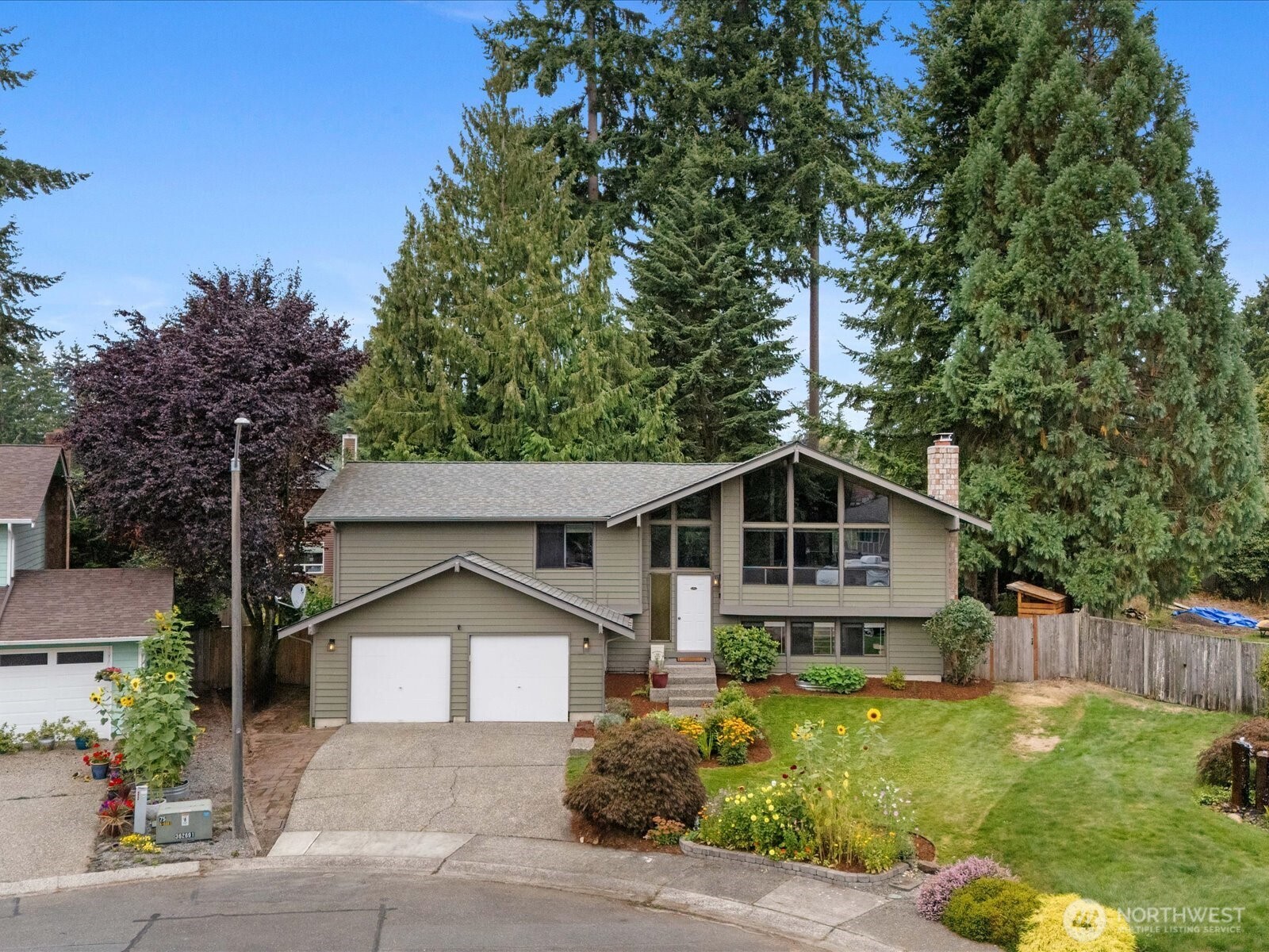 2709 167th Street Southeast Bothell, WA 98012 - Photo 1 of 39 a front view of a house with garden