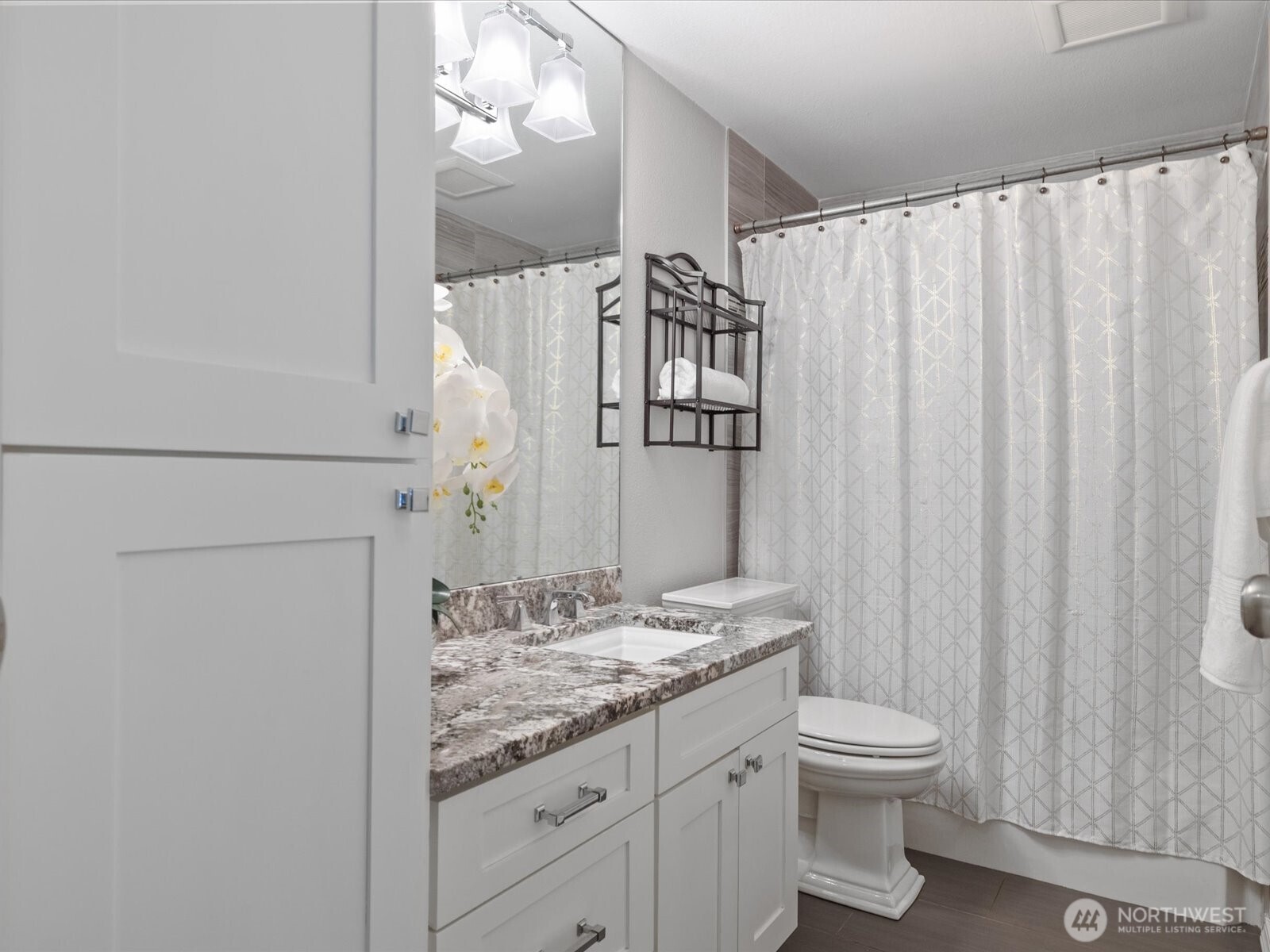 2709 167th Street Southeast Bothell, WA 98012 - Photo 13 of 39 a bathroom with a granite countertop sink and a mirror