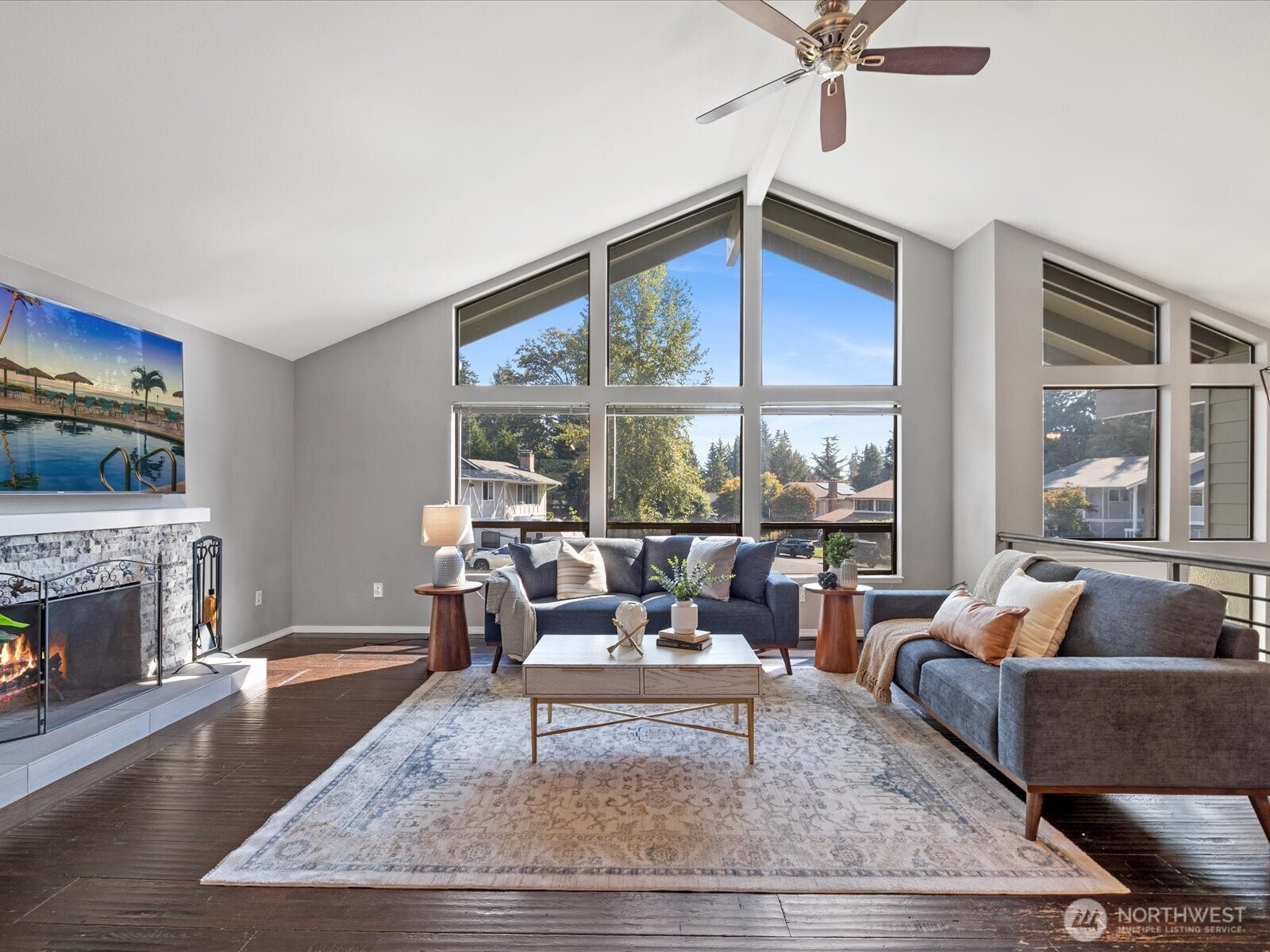 2709 167th Street Southeast Bothell, WA 98012 - Photo 4 of 39 a living room with furniture and a fireplace