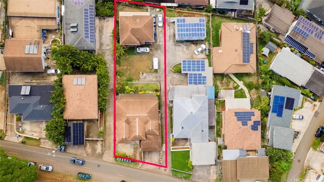 an aerial view of residential houses with outdoor space
