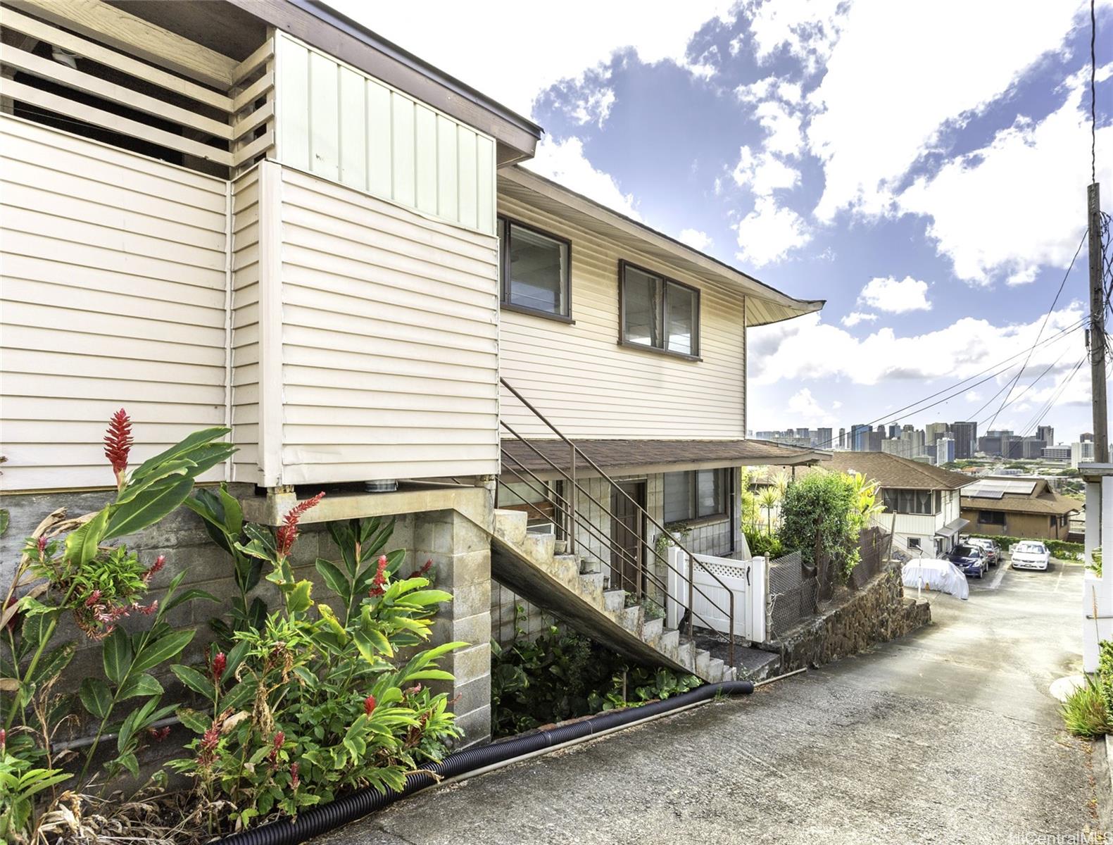 927 Lolena Street Honolulu, HI 96817 - Photo 11 of 12 a balcony with tall trees in front of it