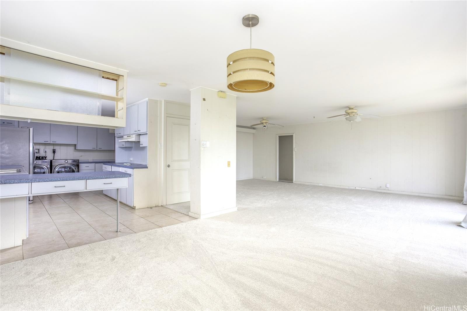 927 Lolena Street Honolulu, HI 96817 - Photo 4 of 12 a view of a kitchen with a sink and cabinets