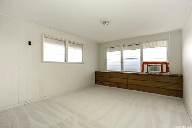 a view of room with window and cabinet