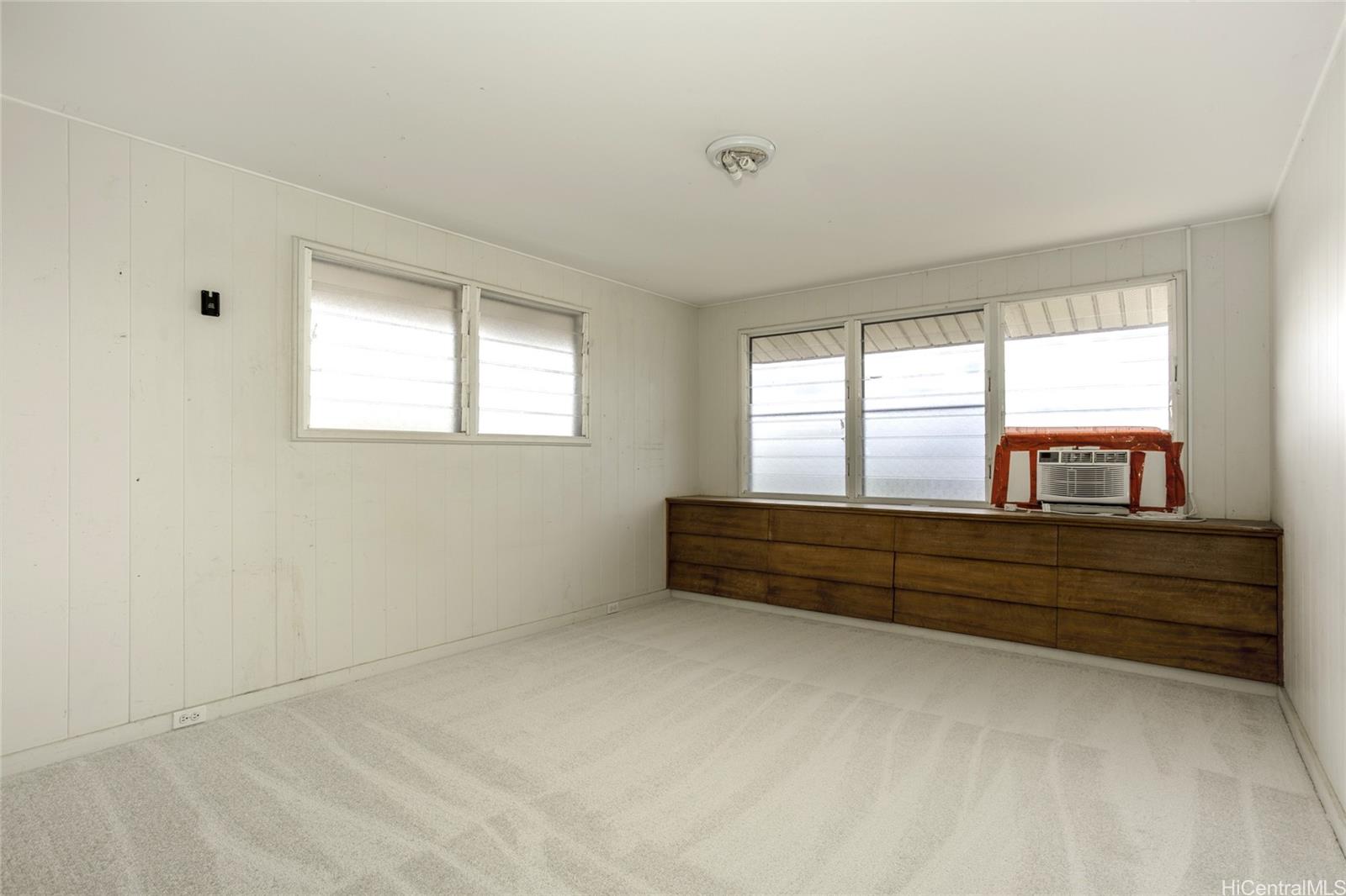 927 Lolena Street Honolulu, HI 96817 - Photo 9 of 12 a view of room with window and cabinet
