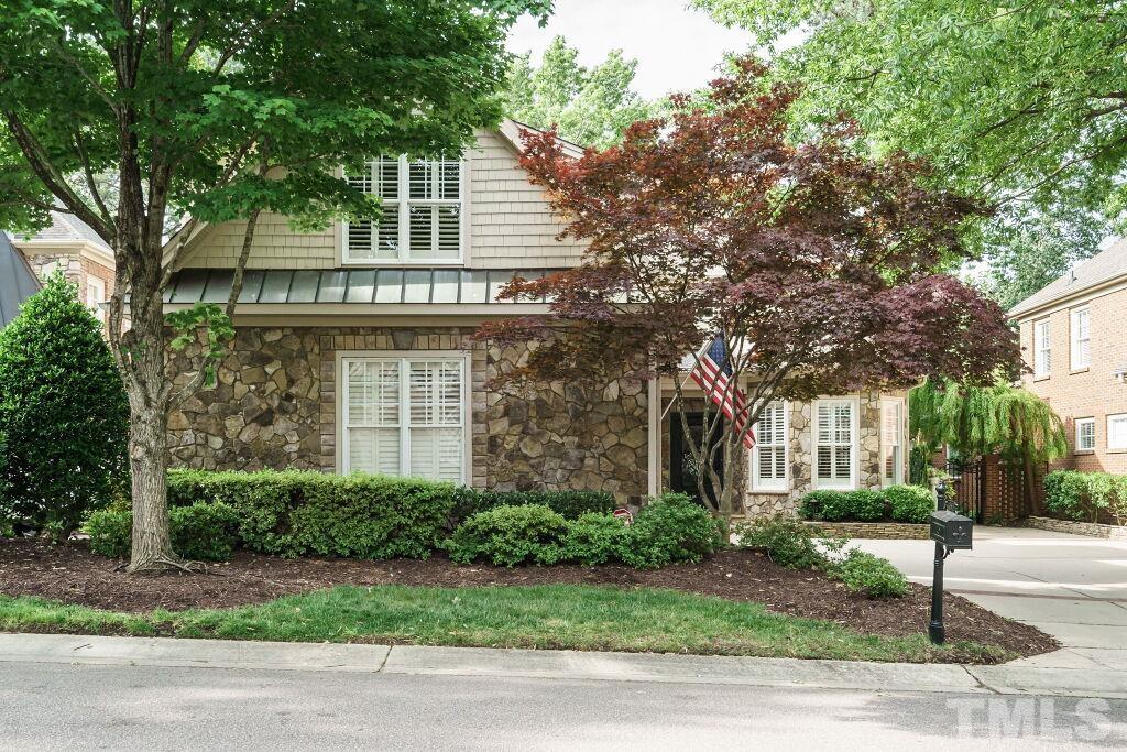 1833 Torrington Street Raleigh, NC 27615 - Photo 2 of 44 a front view of a house with garden