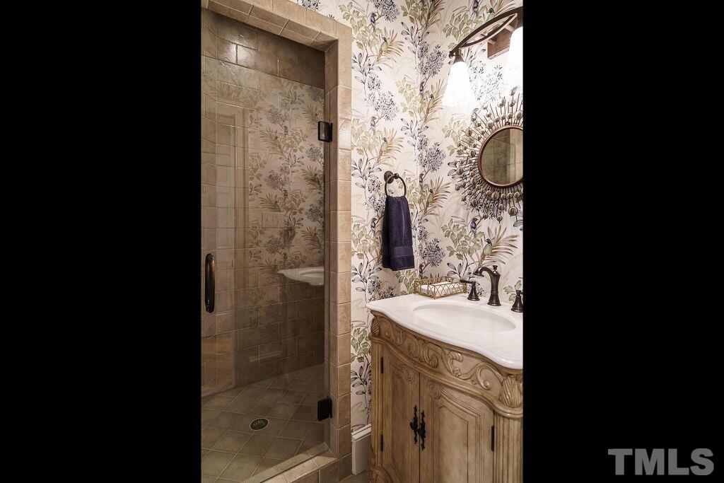 1833 Torrington Street Raleigh, NC 27615 - Photo 32 of 44 a bathroom with a shower and a sink