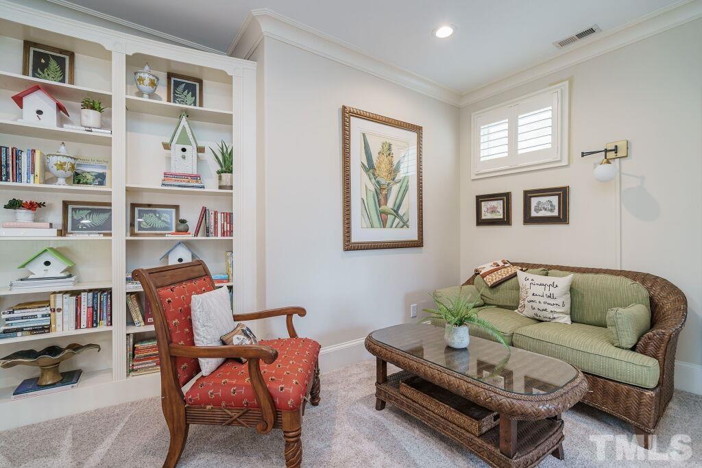 1833 Torrington Street Raleigh, NC 27615 - Photo 33 of 44 a living room with furniture cabinets and window