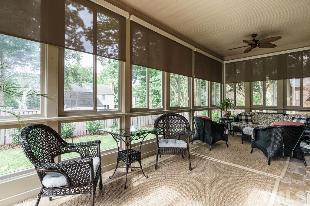 1833 Torrington Street Raleigh, NC 27615 - Photo 41 of 44 a living room with furniture and floor to ceiling windows