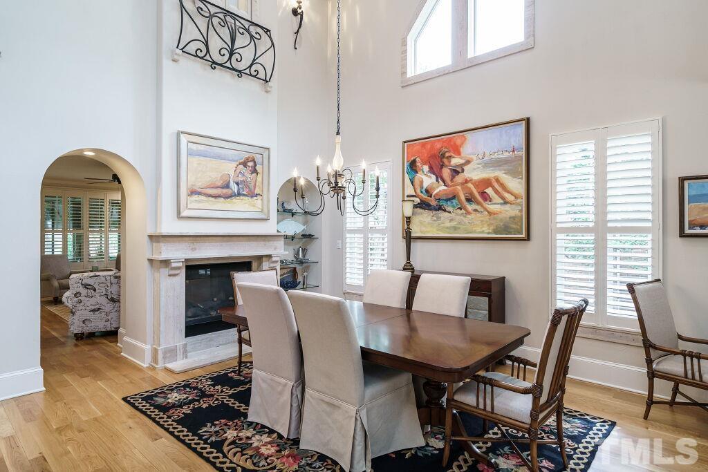 1833 Torrington Street Raleigh, NC 27615 - Photo 9 of 44 a dining room with furniture and wooden floor