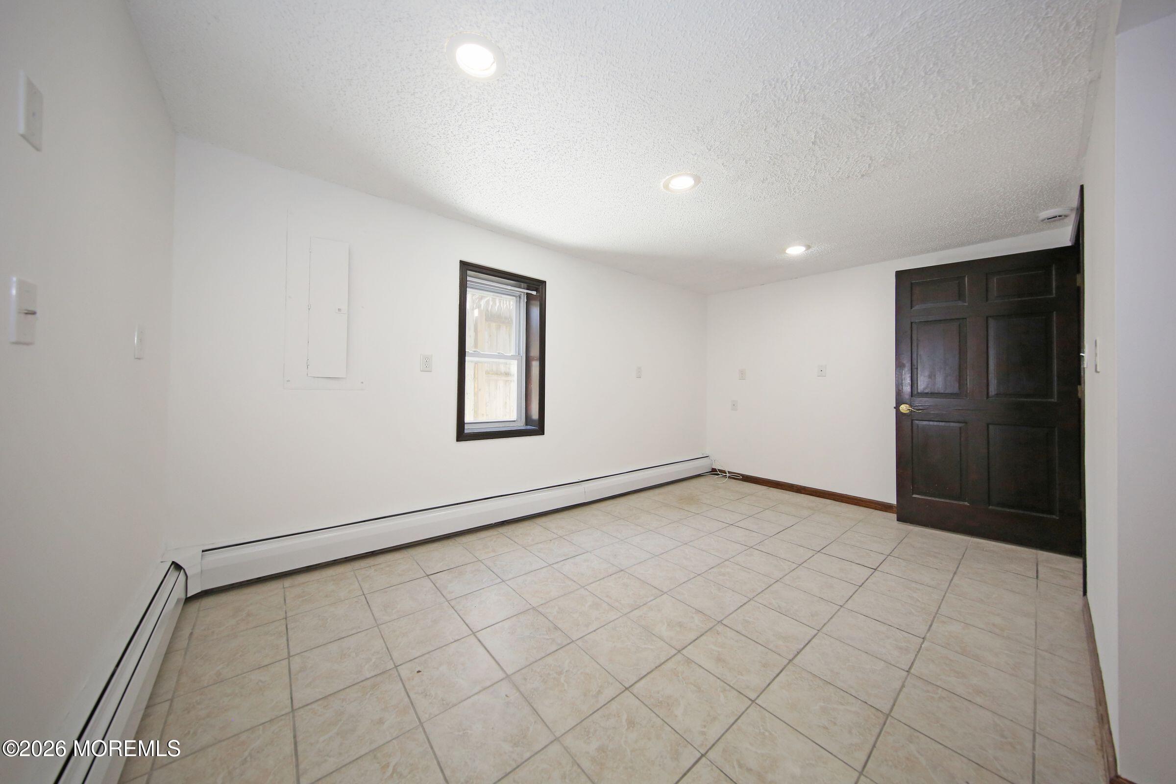 60 Matthew Street, Unit 1 Highlands, NJ 07732 - Photo 16 of 33 an empty room with windows
