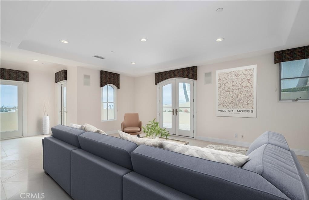 2420 The Strand Manhattan Beach, CA 90266 - Photo 12 of 42 a living room with furniture and a large window