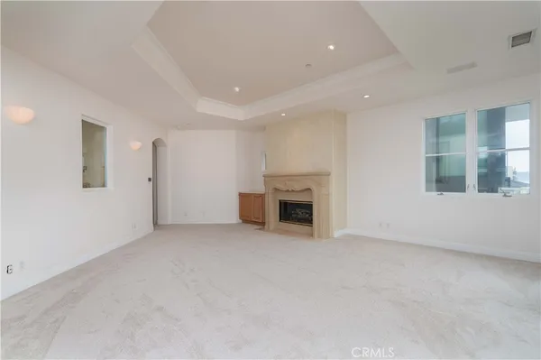 an empty room with fireplace