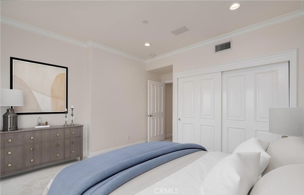 2420 The Strand Manhattan Beach, CA 90266 - Photo 28 of 42 a bedroom with a bed and mirror