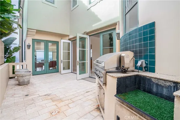 a view of a house with backyard sitting area and garden