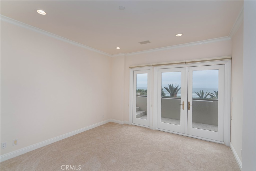 2420 The Strand Manhattan Beach, CA 90266 - Photo 40 of 42 an empty room with sliding glass door and a window