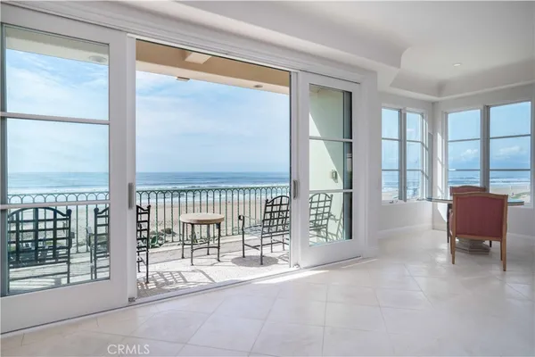 a view of a room with balcony and furniture