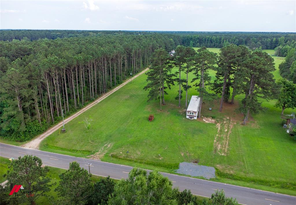 555 Thomasville Road Sarepta, LA 71071 - Photo 29 of 40 an aerial view of residential houses with outdoor space and trees