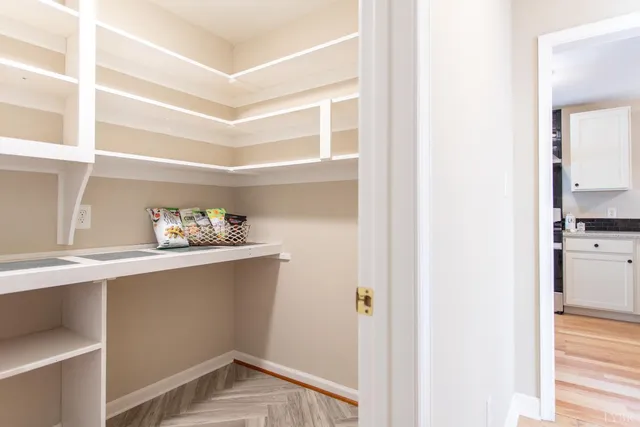 a bathroom with a sink toilet vanity and shower