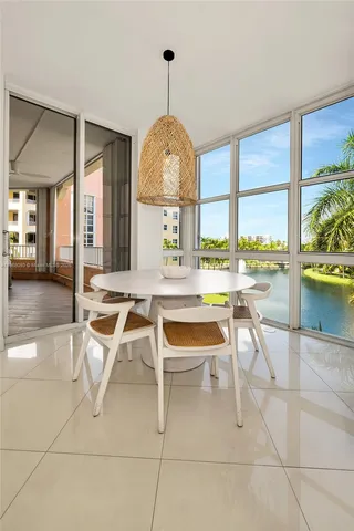 a dining room with a large window and table