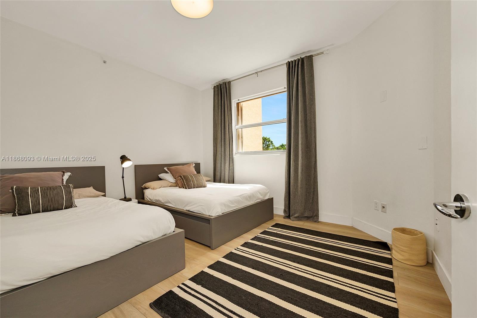 Village of Key Biscayne Key Biscayne, FL 33149 - Photo 12 of 24 a bedroom with two beds and painted walls