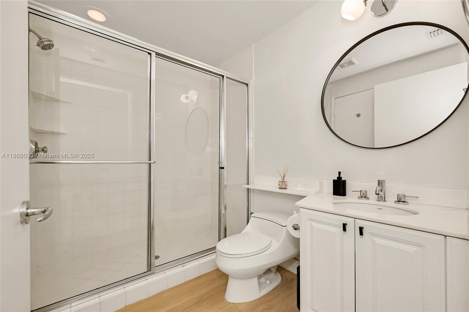 Village of Key Biscayne Key Biscayne, FL 33149 - Photo 14 of 24 a bathroom with a toilet a sink and a mirror