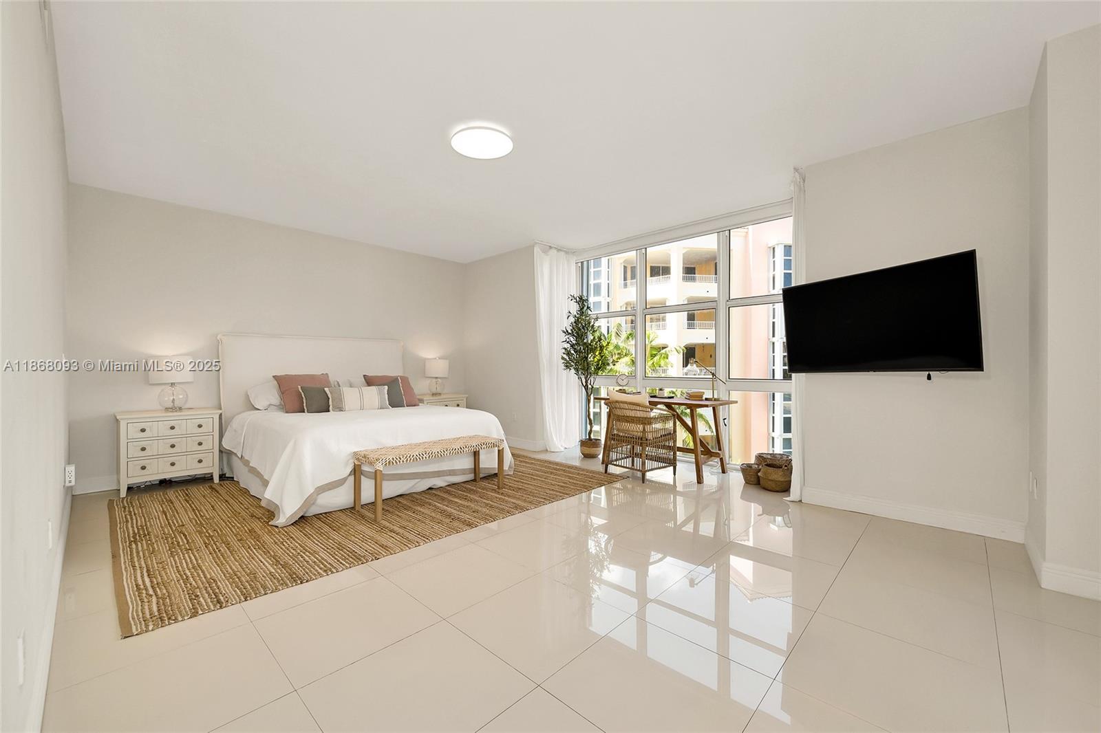 Village of Key Biscayne Key Biscayne, FL 33149 - Photo 18 of 24 a bedroom with a bed and a flat screen tv