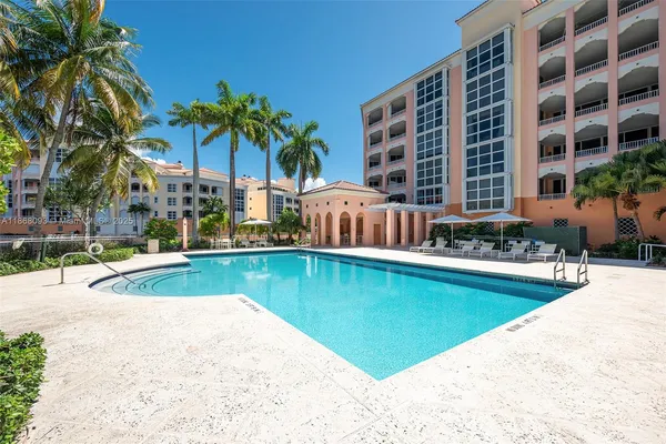 a view of swimming pool and outdoor seating