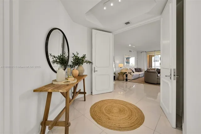 a view of a livingroom with furniture and a mirror