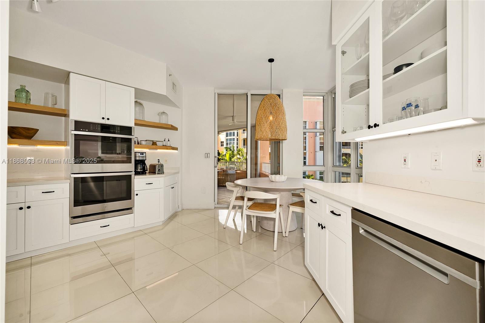 Village of Key Biscayne Key Biscayne, FL 33149 - Photo 8 of 24 a kitchen with stainless steel appliances a stove a sink and a refrigerator