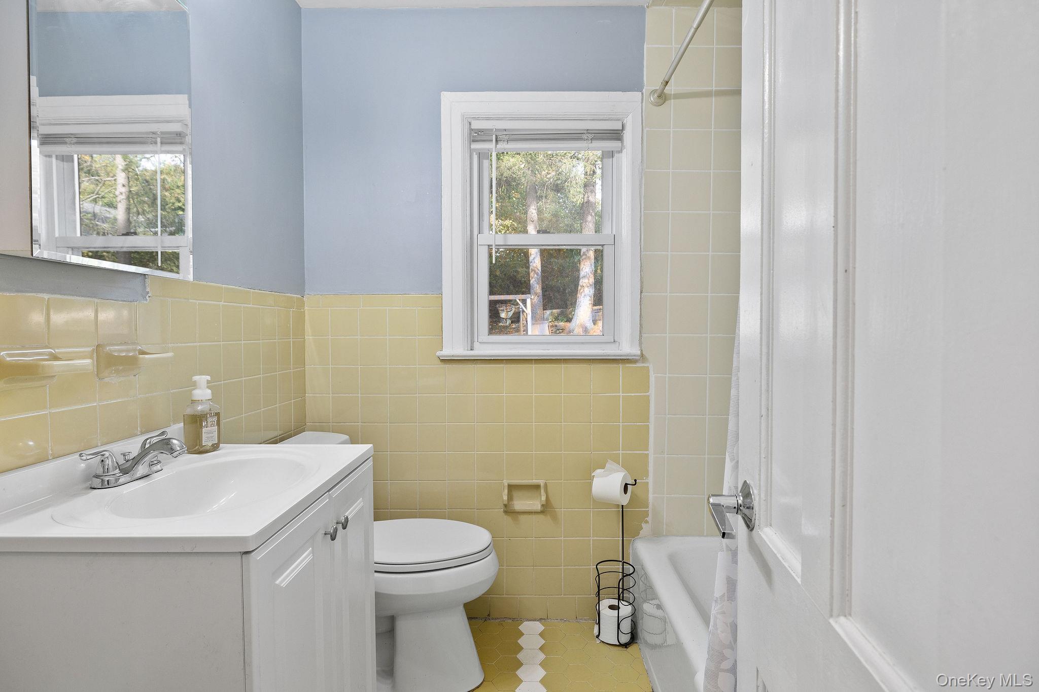 2 Tuxedo Road Carmel, NY 10512 - Photo 11 of 25 a bathroom with a sink a toilet and a window