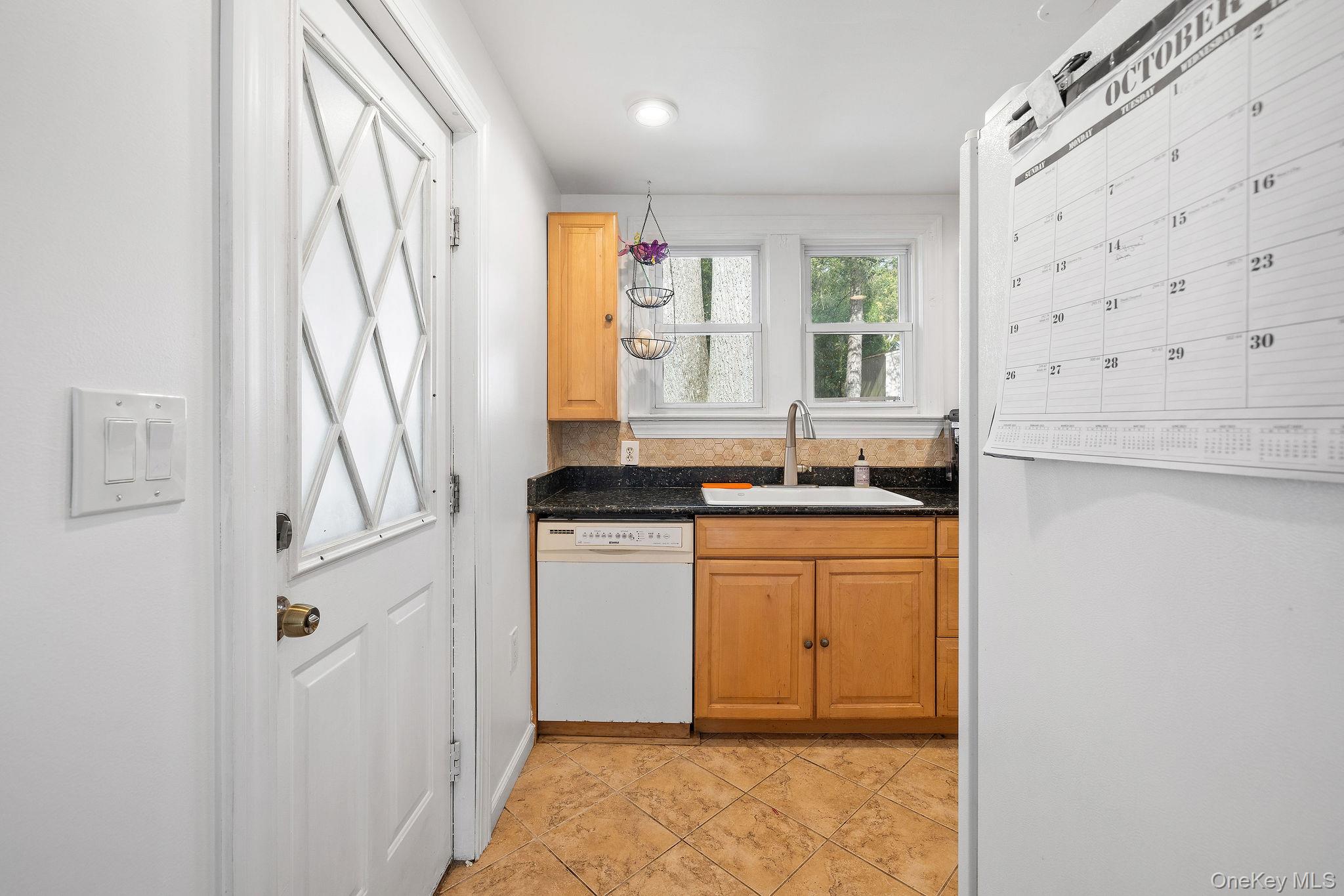 2 Tuxedo Road Carmel, NY 10512 - Photo 16 of 25 a bathroom with a granite countertop sink a mirror and a shower