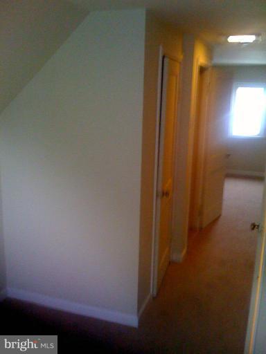 206 West Hilltop Road Brooklyn, MD 21225 - Photo 13 of 15 upstairs hall to bedroom