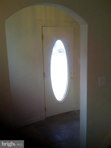 206 West Hilltop Road Brooklyn, MD 21225 - Photo 5 of 15 Seperate tile foyer and front entrance