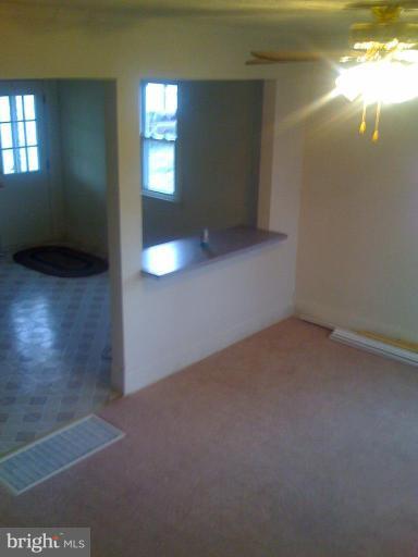 206 West Hilltop Road Brooklyn, MD 21225 - Photo 8 of 15 Living room with kitchen view