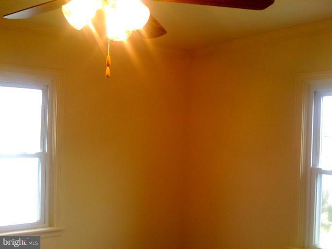 206 West Hilltop Road Brooklyn, MD 21225 - Photo 10 of 15 Ceiling fans in first floor bedrooms