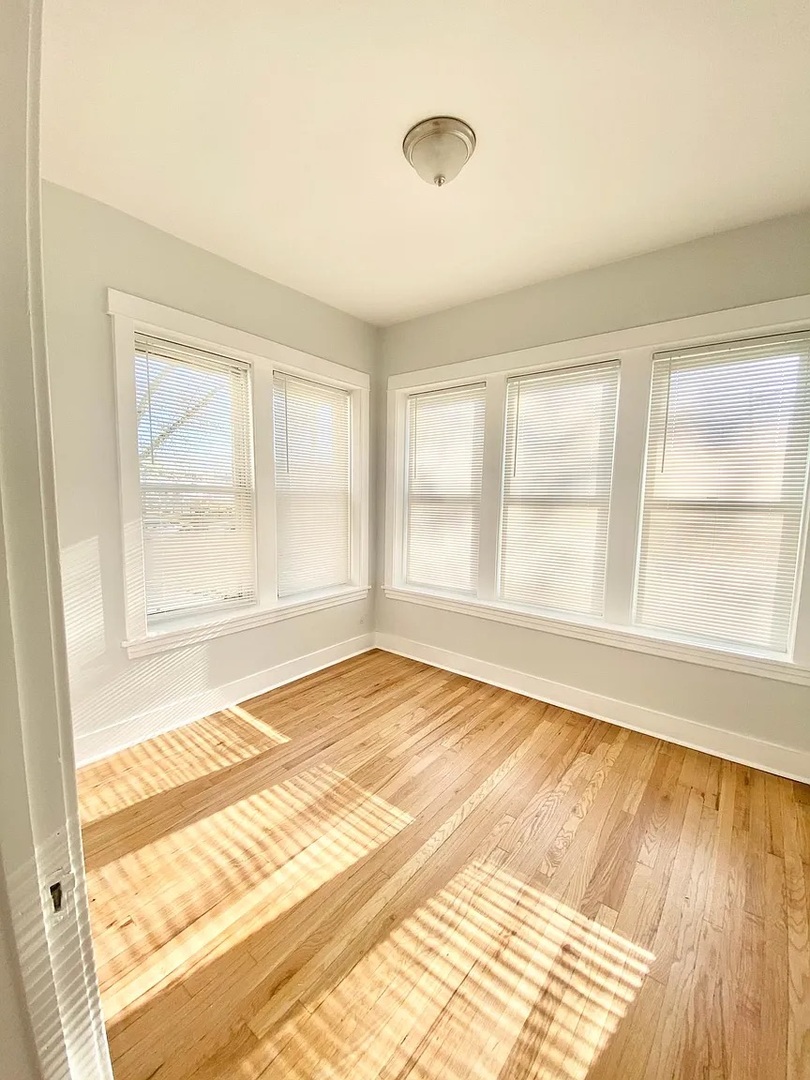 4100 West Henderson Street, Unit 1 Chicago, IL 60641 - Photo 8 of 8 a view of an empty room and window
