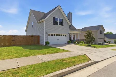a view of front of house with a yard