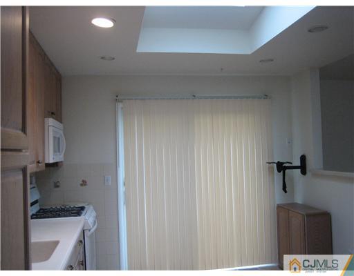 26 Bodnarik Road Edison, NJ 08837 - Photo 3 of 10 a kitchen with a sink and cabinets