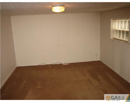 26 Bodnarik Road Edison, NJ 08837 - Photo 8 of 10 a view of an empty room and window
