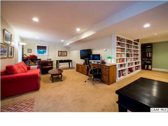 1872 Field Road Charlottesville, VA 22903 - Photo 17 of 29 Built-in shelving at the bottom of the stairs and recessed lighting throughout.