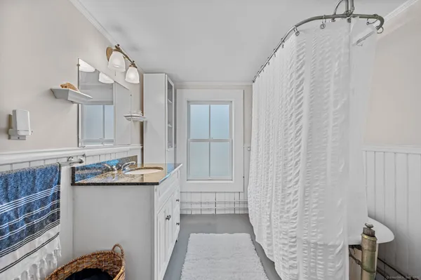 a kitchen with stainless steel appliances white cabinets and white appliances