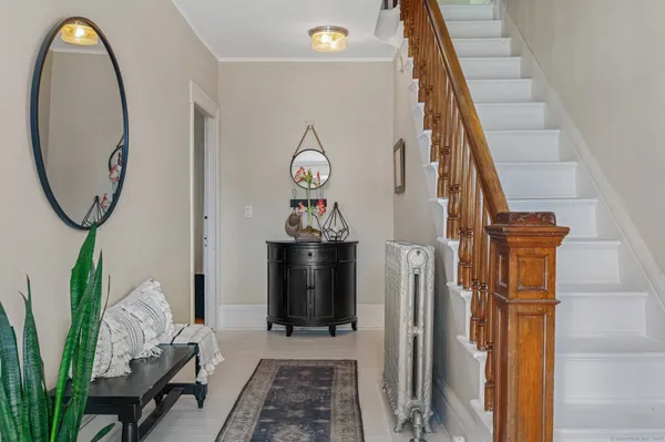 a view of a livingroom with furniture and entryway