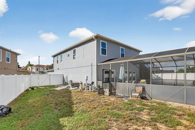 a view of a house with a backyard