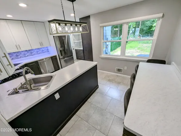 a view of a living room with furniture and a window