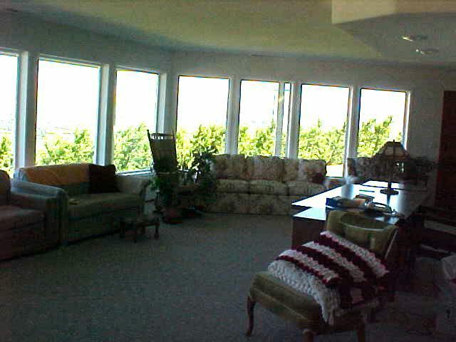 400 Alps Road Moxee, WA 98936 - Photo 8 of 9 a living room with furniture and a floor to ceiling window