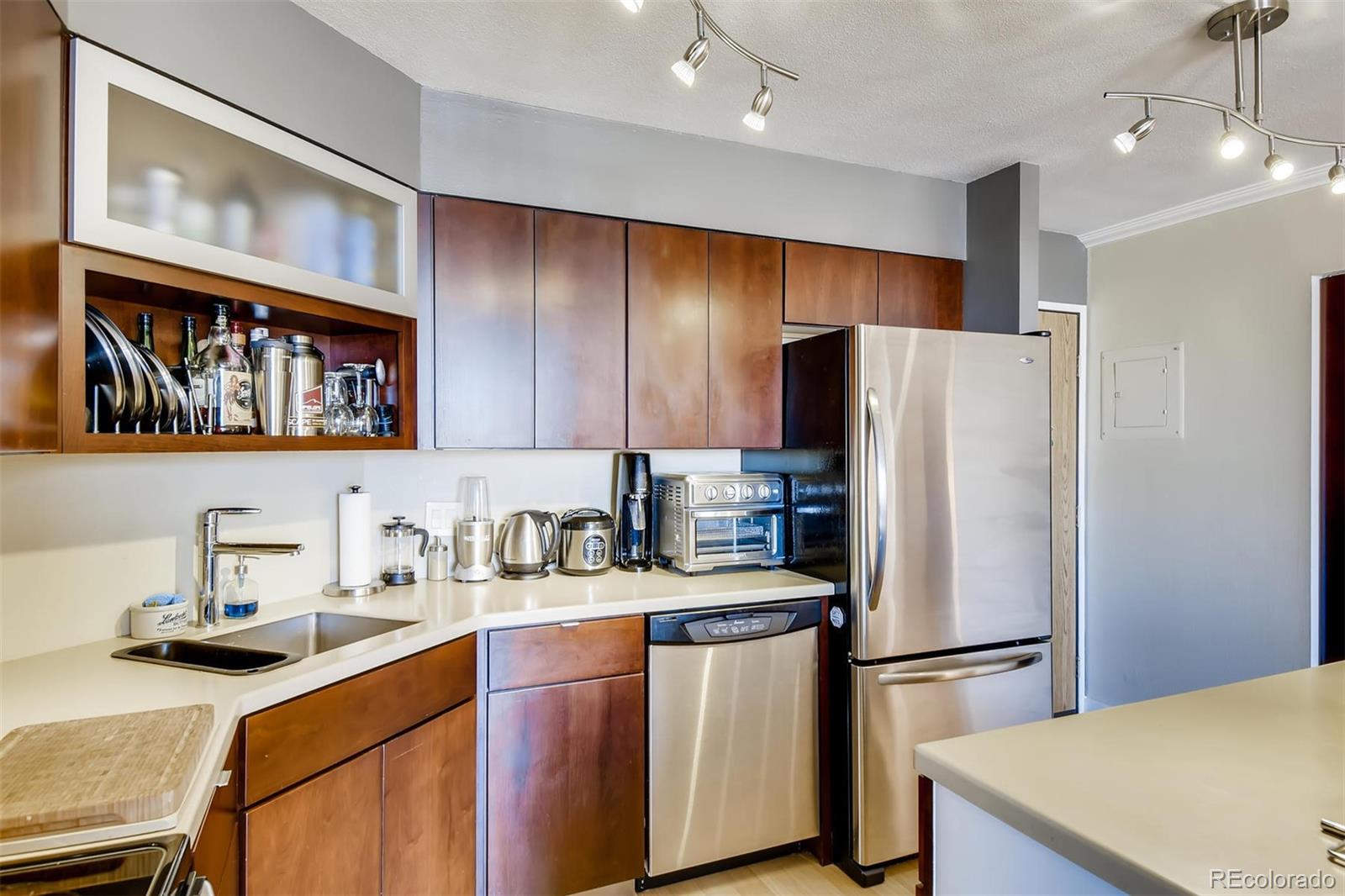 a kitchen with refrigerator a sink and cabinets